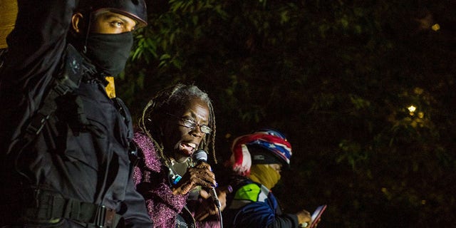 Portland City Commissioner Jo Ann Hardesty addresses protesters as they take part in a rally against police brutality in Portland, Oregon late July 24, 2020.