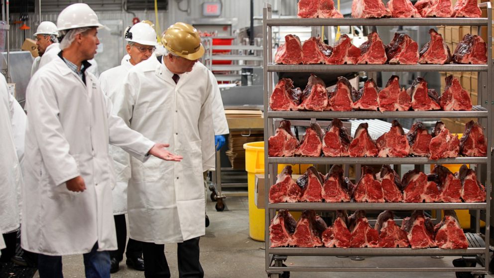 U.S. Agriculture Secretary Tom Vilsack, center, tours the Greater Omaha Packing beef processing plant in Omaha, Neb., on Wednesday, Nov. 2, 2022. Greater Omaha is receiving a $20 million grant to expand its operations as part of a larger USDA program