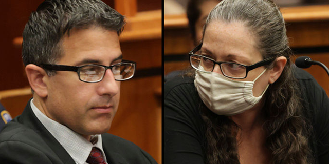 Michael Valva and Angela Pollina sit together inside Suffolk County Supreme Court Judge William Condon's courtroom for their murder trials in Riverhead, New York on Sept. 12.