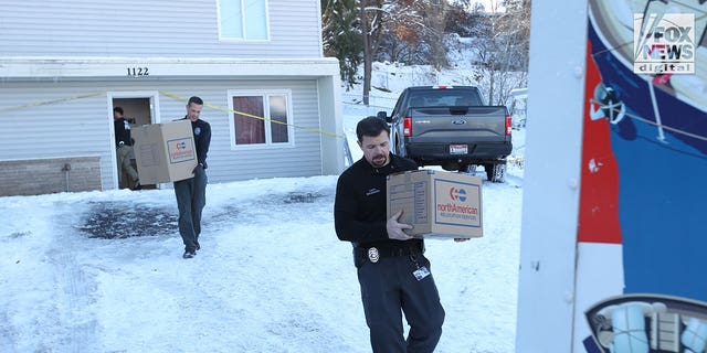 The belongings of the victims of the University of Idaho quadruple homicide are removed from the house in Moscow, Idaho, Wednesday, December 7, 2022.