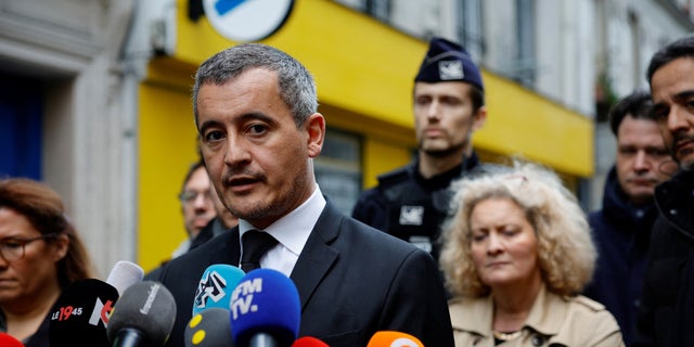 French Interior Minister Gerald Darmanin talks to journalists during a visit to Rue d'Enghien after gunshots were fired, killing and injuring several people in a central district of Paris on Friday.  