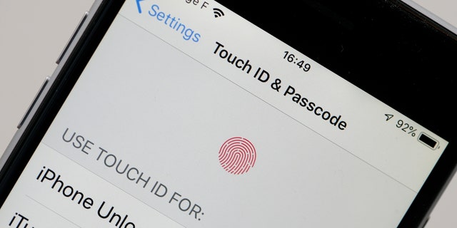 In this photo illustration, the setting page to use ID touch is displayed on the screen of an iPhone on Feb. 7, 2019, in Paris.