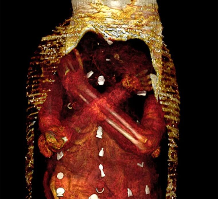 Wrappings are digitally removed to reveal amulets covering the body.