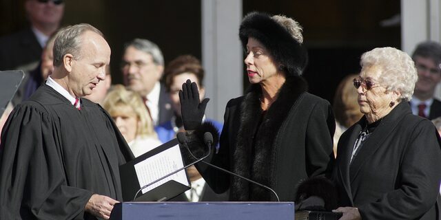 North Carolina State Auditor Beth Wood, center, is sworn into office by Supreme Court Justice Paul Newby as her mother Betty Wood looks on during North Carolina inaugural ceremonies on Jan. 10, 2009, at the State Library building in Raleigh.