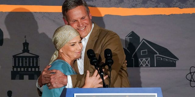 Tennessee Gov. Bill Lee hugs his wife, Maria, as he speaks to supporters after he was declared the winner in his bid for re-election on Nov. 8, 2022, in Franklin, Tennessee.