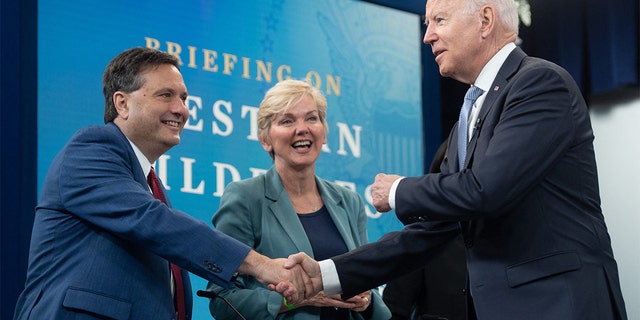 President Biden shakes hands with former White House chief of staff Ron Klain alongside Granholm on June 30, 2021.