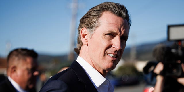 California Gov. Gavin Newsom heads to a press conference in Half Moon Bay, Calif., on Jan. 24, 2023.