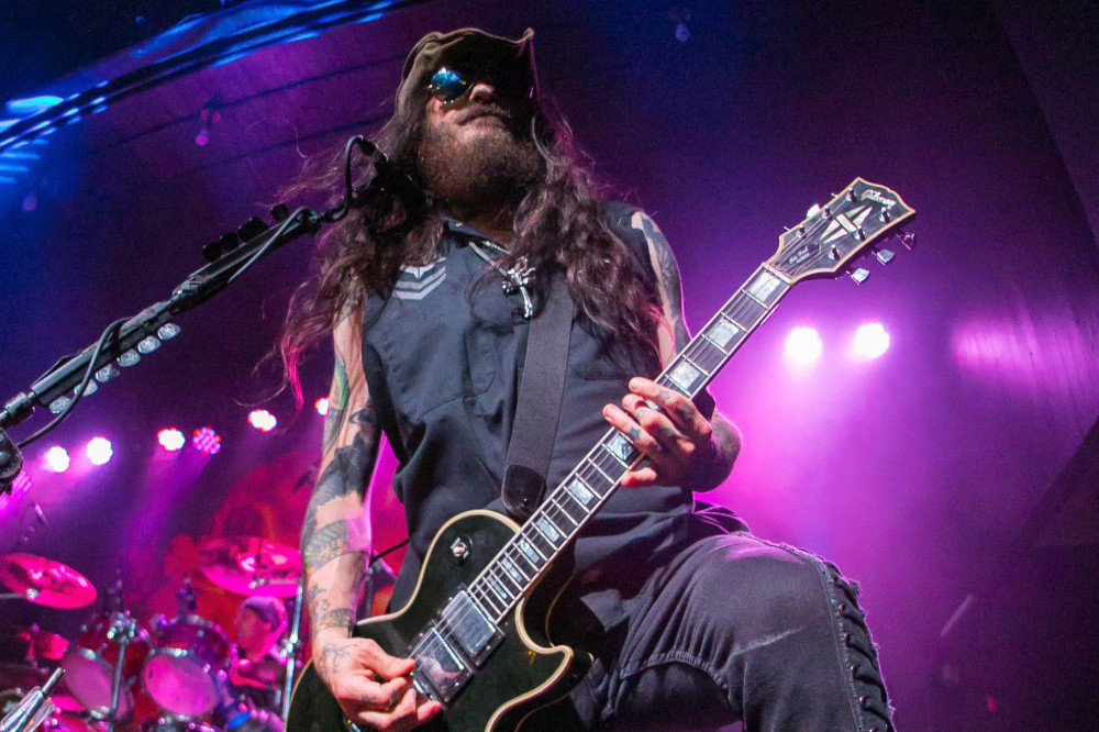 Wayne Swinny's bandmate Bobby Amaru hailed him a 'Guitar Hero with swag'