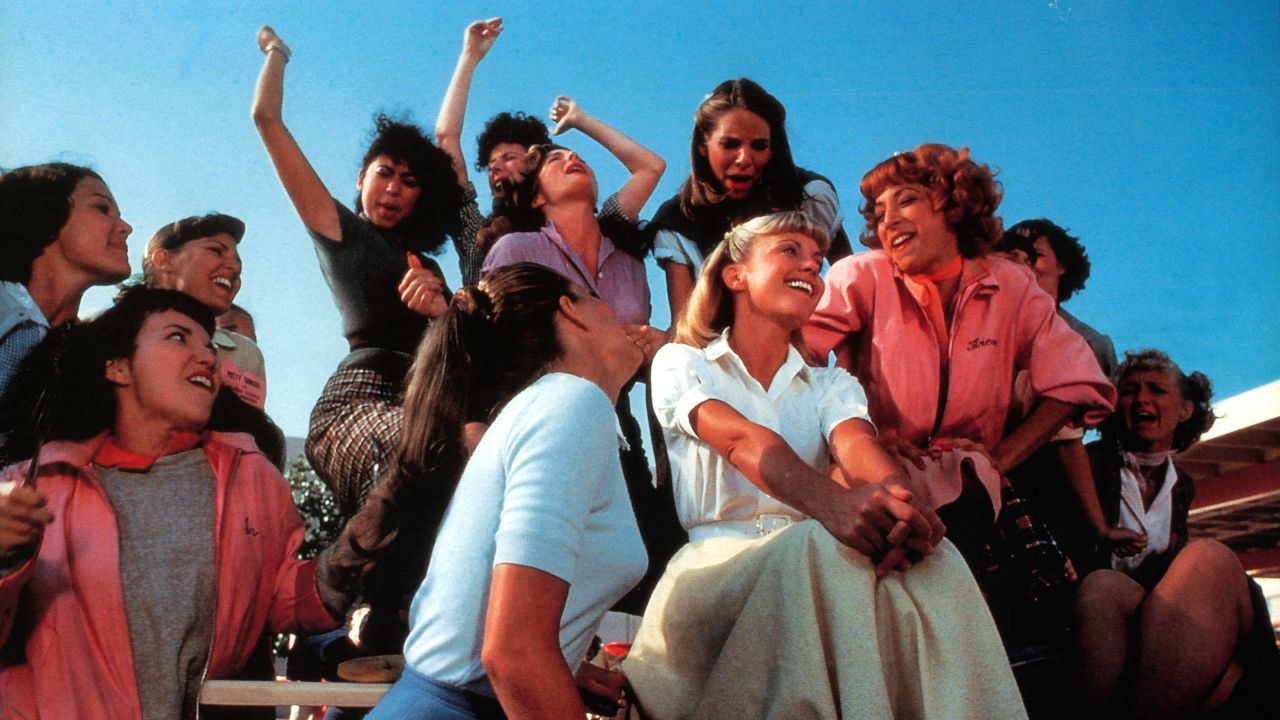 Olivia Newton-John, Didi Conn and the rest of the girls sing in a scene from the film 'Grease', 1978.