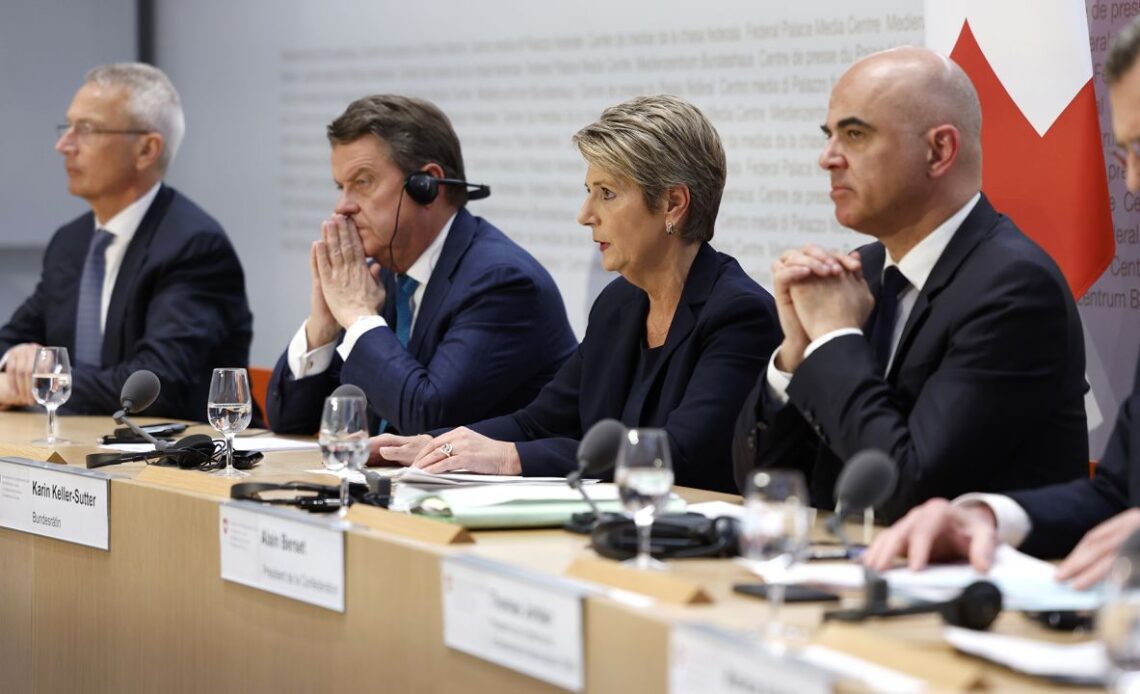 Swiss finance minister Karin Keller-Sutter, center, speaks during a press conference in Bern, Switzerland, on March 19, 2023.