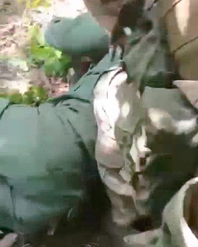 A video that Ukrainian authorities say shows a Russian soldier decapitating a Ukrainian prisoner of war.  (Telegram)