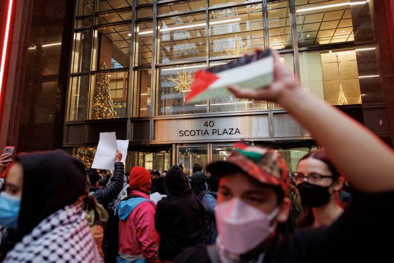 Demonstrators stage a sit-in at Scotiabank's Toronto headquarters in November 2023.