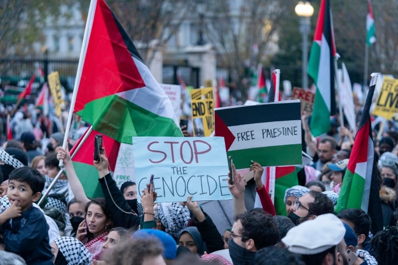 Anti-war activists protest outside of the White House.