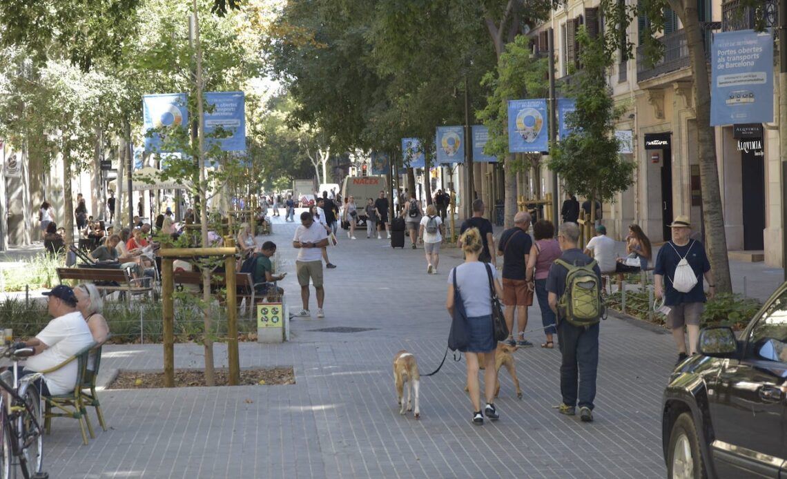 Several people walk along Consell de Cent street on September 8, 2023, in Barcelona, Catalonia, Spain.