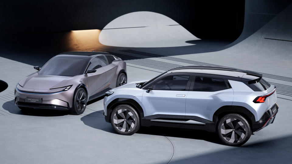 Two Toyota SUV concepts sit in a sleek, modern showroom. A Crossover Sport sits on the left, while an Urban SUV one is on the right.