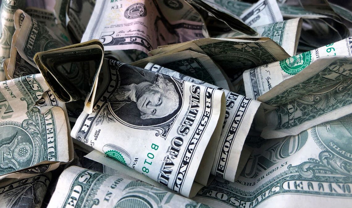 A box filled with dollar bills