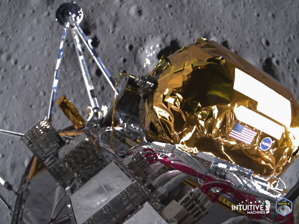 This image provided by Intuitive Machines on Tuesday, Feb. 27, 2024 shows its Odysseus lunar lander over the south pole region of the Moon. The toppled lunar lander is still beaming back pictures of the moon, as its nears the final hours of its life. The photos were taken shortly before last Thursday's touchdown. (Intuitive Machines via AP)