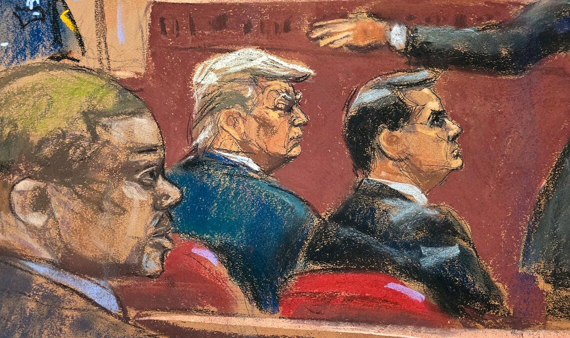 Donald Trump watches with his attorney Todd Blanche as prosecutor Matthew Colangelo makes opening statements during Trump's criminal trial