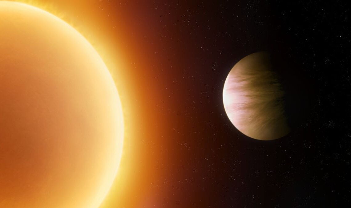 a pale yellow planet orbits close to a large orange star