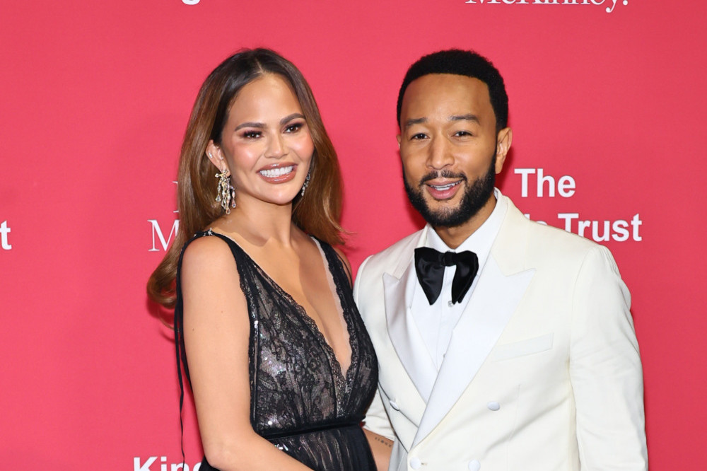 John Legend has revealed how Chrissy Teigen hurt her neck