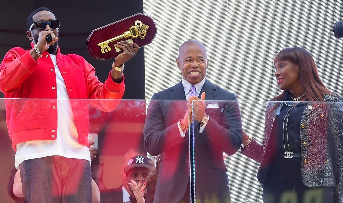 Sean "Diddy" Combs (L) is seen receiving the Key to the City from Mayor Eric Adams