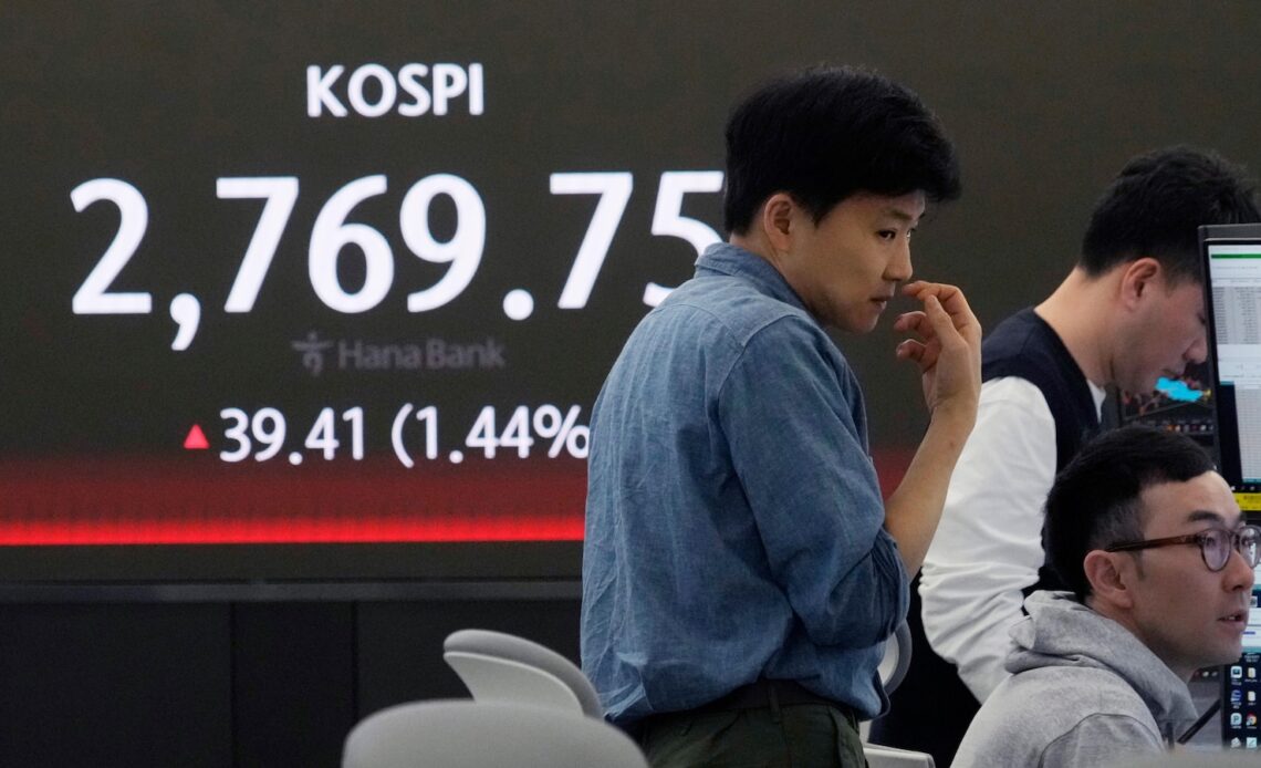 Stock market today: World shares are mixed after Wall St hits fresh records on hopes for rate cuts