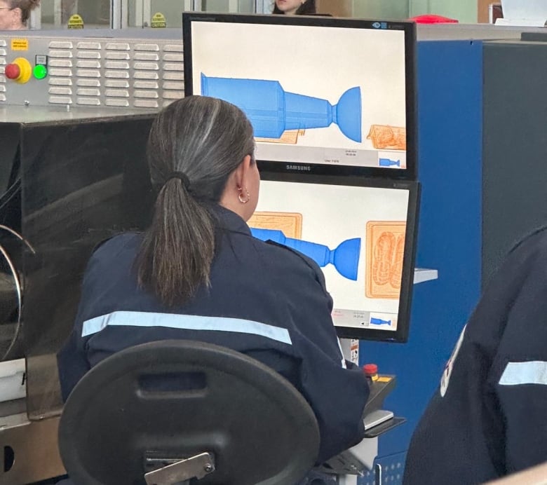 Airport security screens show a trophy.