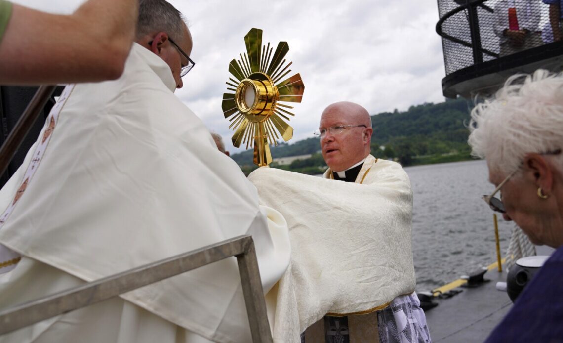 On heartland roads, and a riverboat, devout Catholics press on with two-month nationwide pilgrimage