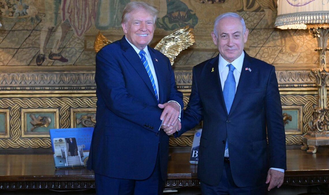 Donald Trump shakes hands with Israeli Prime Minister Benjamin Netanyahu