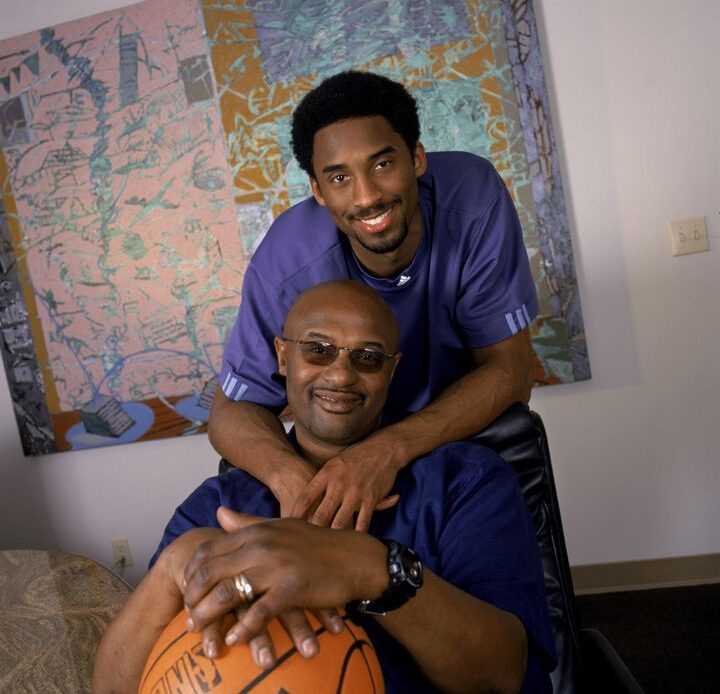 Kobe Bryant (top) poses for a portrait with his father Joe "Jellybean" Bryant in November 2000. It was announced Tuesday that Joe Bryant had died at age 69 after a serious stroke.