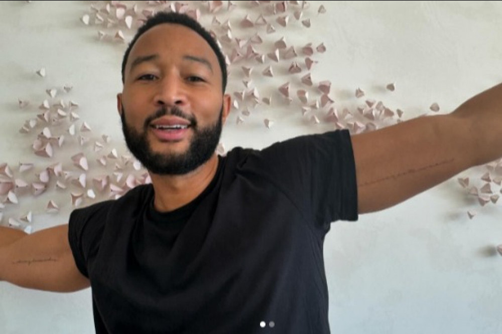 John Legend shows off his new tattoo in tribute to children