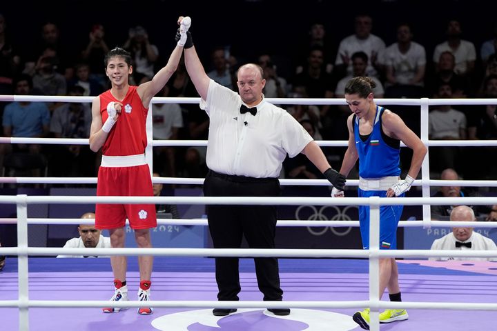 Taiwan's Lin Yu-ting celebrates after defeating Bulgaria's Svetlana Staneva in their women's 57 kg quarterfinal boxing match.