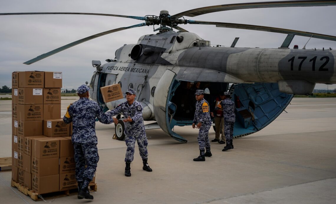 Along Mexico's Pacific coast, flooding from Hurricane John left devastated towns and 17 dead