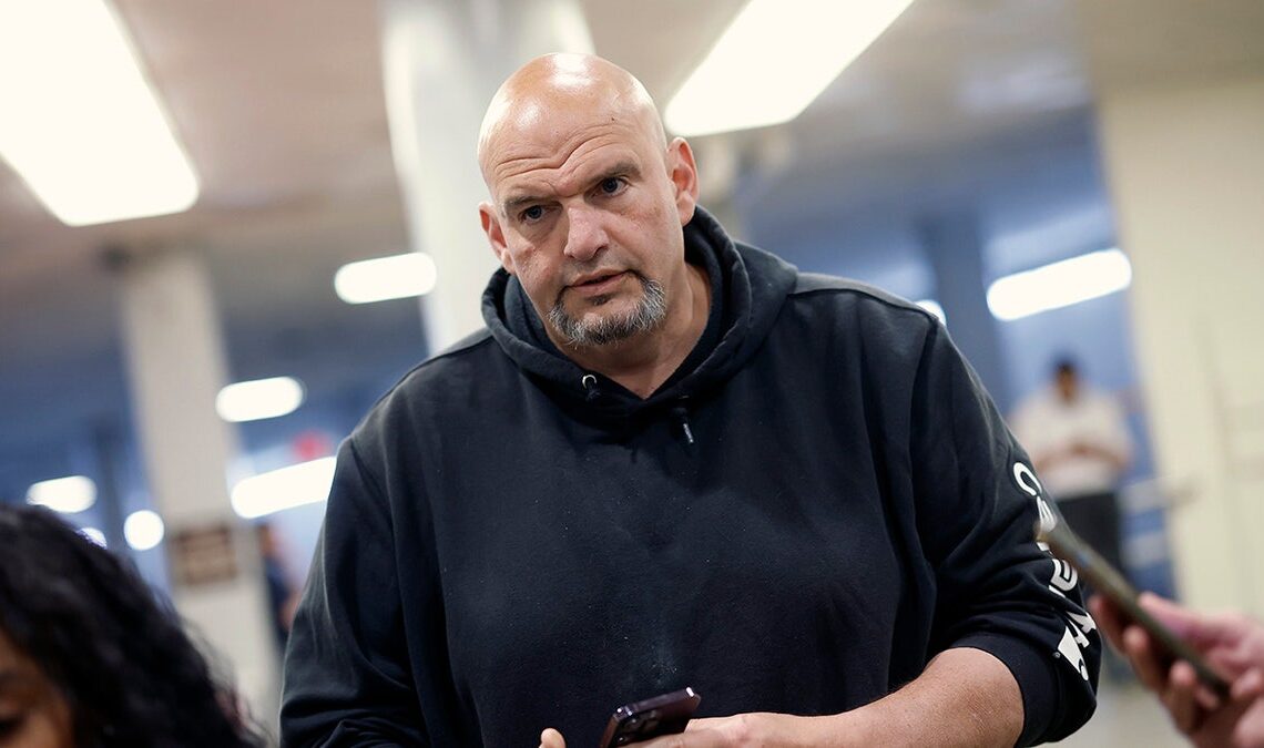 Fetterman in Senate hallway wearing black sweats