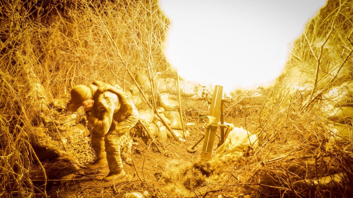 A serviceman of the 24th mechanized brigade named after King Danylo of the Ukrainian Armed Forces fires a 120-mm mortar towards Russian troops at a frontline on Tuesday.