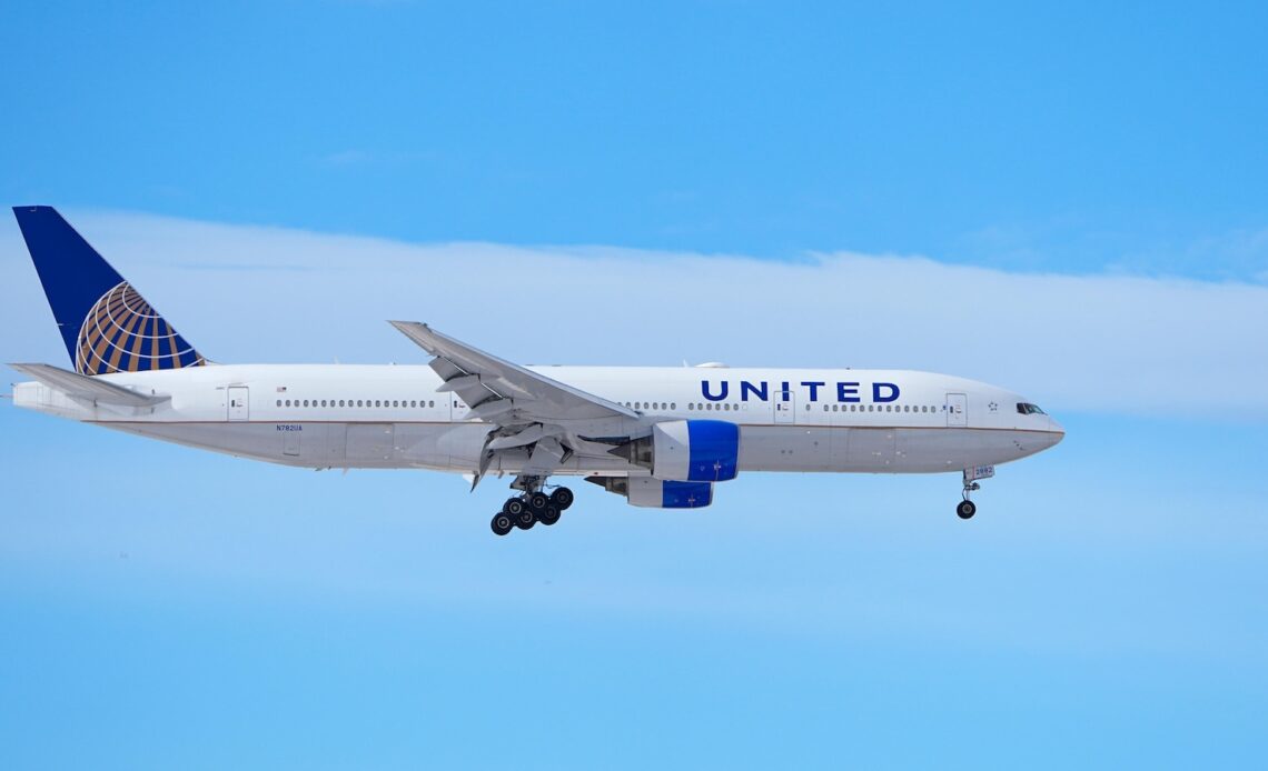 A man is accused of punching and bloodying another passenger who was sleeping on a US flight