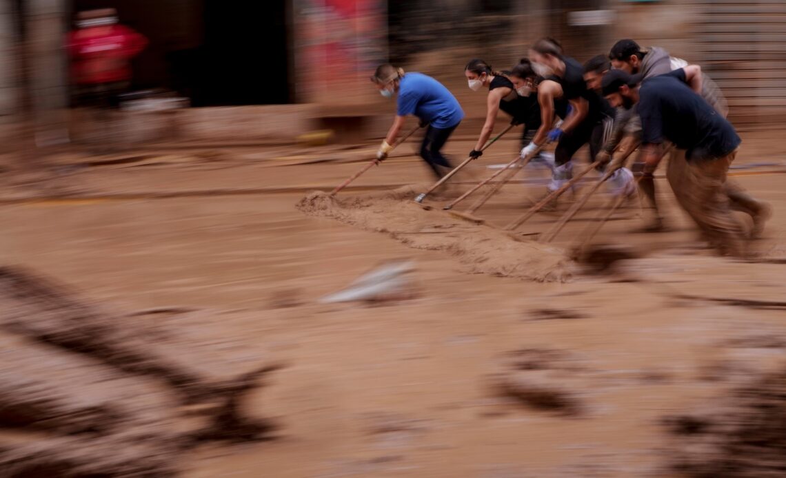 AP PHOTOS: Death by water, burial by mud. Images of Spain's floods of the century