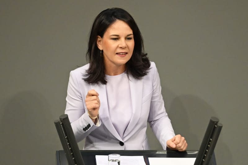 Annalena Baerbock, German Foreign Minister, follows the debate in the plenary session of the Bundestag. The agenda includes a topical debate on the World Climate Conference. Anna Ross/dpa