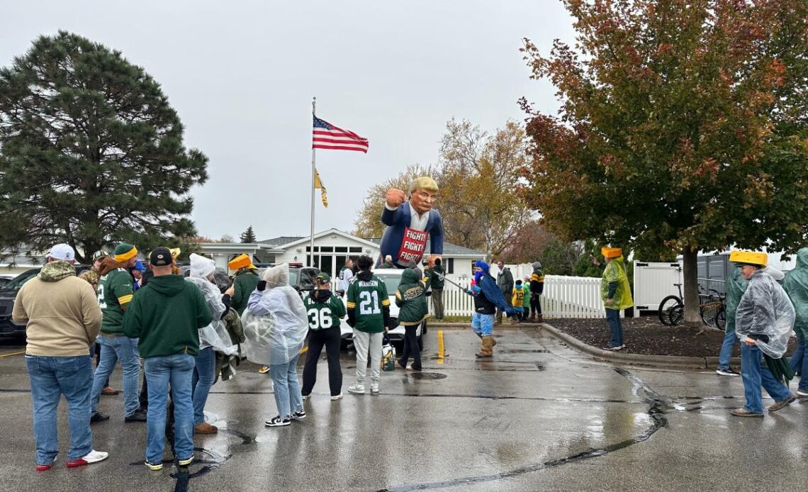 Politics infiltrates Packers pregame, with Eric Hovde tailgating, a Trump inflatable, a Harris banner in the sky