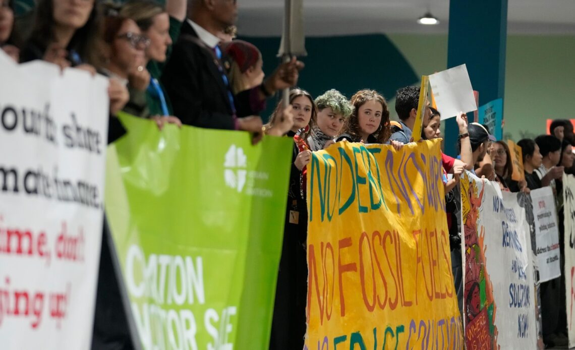 Protesters gather at UN climate talks in global day of action as progress on a deal slows