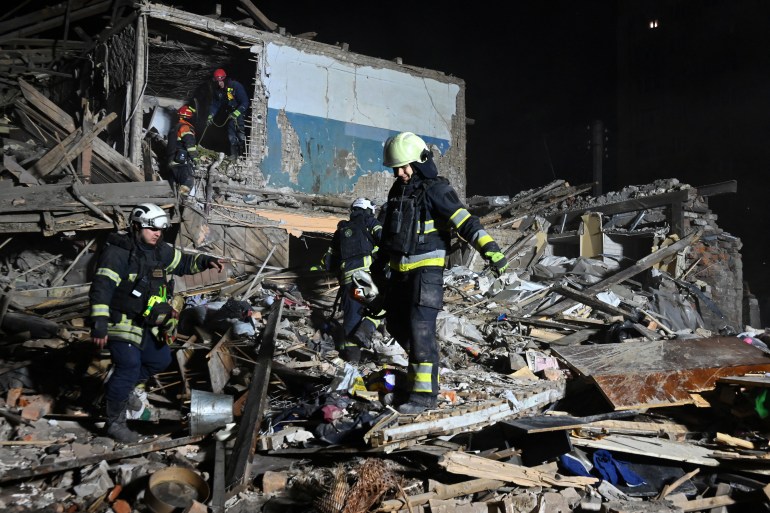 Rescuers of the State Emergency Service inspect the remains of a residential building after a strike in Kharkiv, on November 1, 2024. [SERGEY BOBOK / AFP]