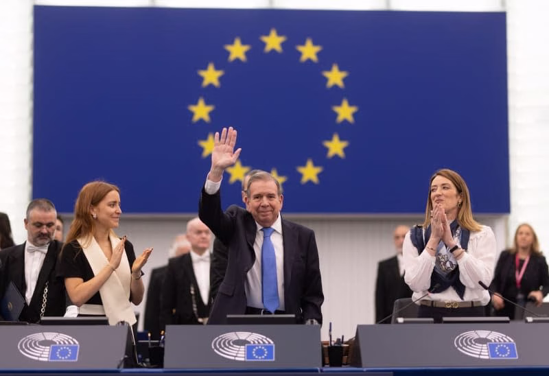 Sakharov Prize winner Edmundo Gonzalez Urrutia (C), European Parliament President Roberta Metsola (R) and Ana Corina Sosa, the daughter of Sakharov Prize winner M. C. Machado, who was not present in person, react during the plenary session of the European Parliament in Strassbourg. The Venezuelan opposition has been awarded the Sakharov Prize on the second day of December's plenary session. Philipp von Ditfurth/dpa