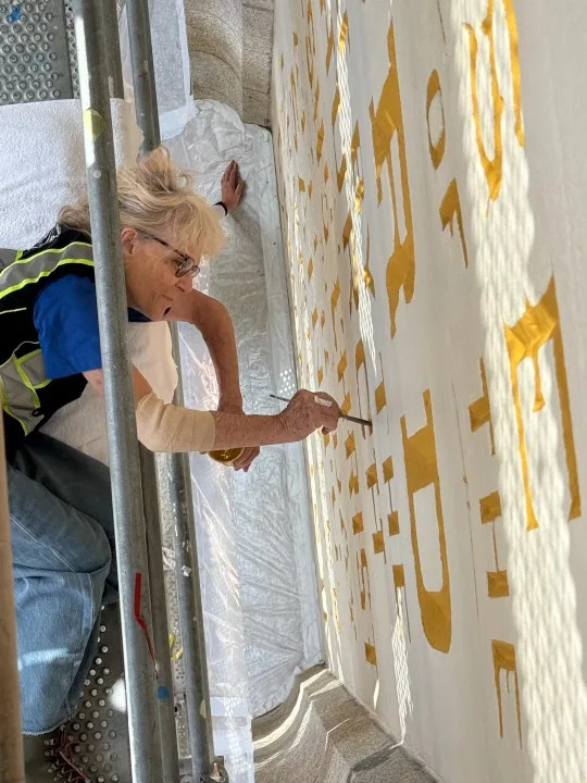 Anne Domenech works to restore the “Holiness to the Lord” panel, courtesy Church of Jesus Christ of Latter-day Saints