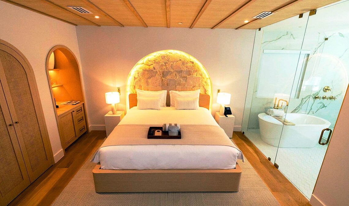 Hotel room with the lights on.
